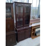 A MAHOGANY BOOKCASE CABINET WITH TWO LOWER DOORS AND DRAWERS AND TWO UPPER GLAZED DOORS