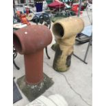 A LARGE RED COLOURED CHIMNEY POT