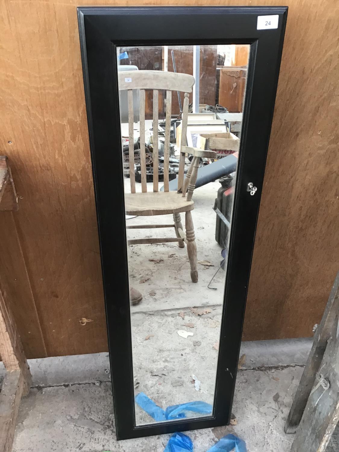 A MIRROR FRONTED TALL KEY/STORAGE CABINET WITH KEY