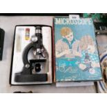 A VINTAGE BOXED STUDENTS MICROSCOPE