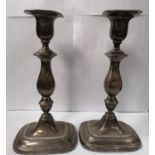 A PAIR OF SHEFFIELD HALLMARKED SILVER CANDLESTICKS, WEIGHTED BASES, HEIGHT 23 CM