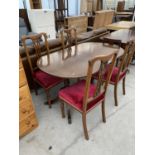 A MAHOGANY EXTENDING DINING TABLE AND FOUR HIGH BACKED DINING CHAIRS