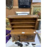 AN APPRENTICE DRESSER WOODEN UNIT WITH DRAWS AND CUPBOARDS