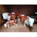 A SET OF THREE CERAMIC BUTCHERS HEREFORD BULL, COW AND CALF MODELS