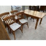 A RECTANGULAR PINE DINING TABLE AND FOUR PINE DINING CHAIRS