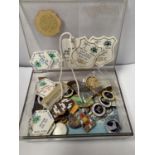 A BOX CONTAINING ASSORTED DOG AND HORSE SHOW BADGES
