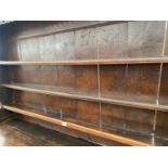 AN 18TH CENTURY OAK DRESSER WITH THREE TIER PLATE RACK HAVING CARVED AND PIERCED CORNICE. THE BASE