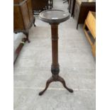 A CARVED MAHOGANY TORCHERE ON PEDESTAL SUPPORT