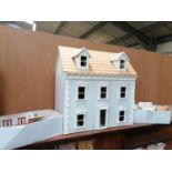 A WOODEN DOLLS HOUSE AND ASSORTED DOLLS HOUSE FURNITURE