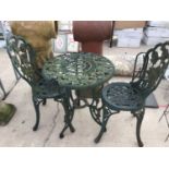 AN ORNATE CAST IRON ROSE DESIGN TABLE (A/F) WITH TWO MATCHING CHAIRS