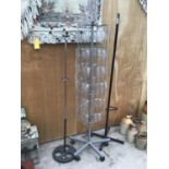 TWO BLACK MODERN COAT STANDS AND A ROTATING CARD STAND