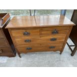 AN EARLY 20TH CENTURY SATINWOOD CHEST OF TWO SHORT AND TWO LONG DRAWERS ON CASTERS