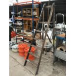 A VINTAGE WOODEN STEP LADDER AND A WROUGHT IRON SEMI CIRCULAR TABLE WITH FROSTED GLASS TOP