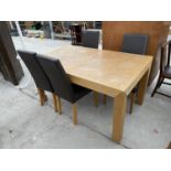 A MODERN OAK DINING TABLE AND FOUR HIGH BACKED LEATHER DINING CHAIRS