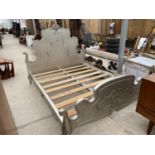 A SILVER DOUBLE BED WITH DECORATIVE HEAD AND FOOT BOARDS