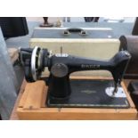 A VINTAGE SINGER SEWING MACHINE WITH CASE