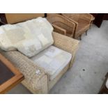 TWO WICKER ARMCHAIRS, A TWO SEATER SOFA AND SIDE TABLE
