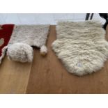 TWO SHEEPSKIN RUGS