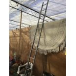 A MIXED LOT TO INCLUDE A FOUR SECTION TWELVE RUNG ALLOY LADDER, A THICK ROPE, GARDEN CHAIR,