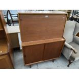 A GIBBS TEAK BUREAU WITH FALL FRONT AND TWO SLIDING DOORS