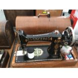 A VINTAGE SINGER SEWING MACHINE WITH CASE