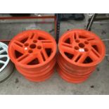 FOUR ORANGE PAINTED ALLOY WHEELS 15 INCH