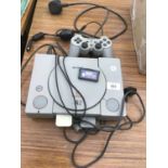 AN ORIGINAL SONY PLAYSTATION WITH CONTROLLER AND GAME