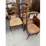 AN OAK LADDER BACK FARMHOUSE CHAIR WITH RUSH SEAT AND THREE MAHOGANY BEDROOM CHAIRS WITH RATTAN