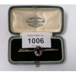 A LADIES 9CT YELLOW GOLD AND AMETHYST PINK STONE BROOCH, BOXED, WEIGHT 3.3G
