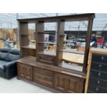 A LARGE MAHOGANY CABINET WITH TWO DOORS, THREE DRAWERS AND UPPER SHELVING