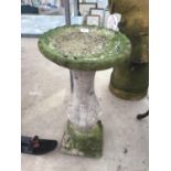 A CONCRETE BIRD BATH