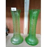 A PAIR OF IRIDESCENT GREEN GLASS VASES
