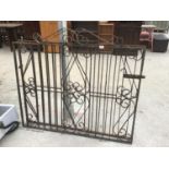 A PAIR OF ORNATE WROUGHT IRON GATES EACH GATE 128CM X 112CM TO HIGHEST POINT