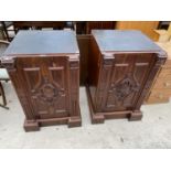 TWO MAHOGANY PEDESTALS, EACH WITH CARVED PANEL DOOR AND INNER DRAWER WITH RECESSED BRASS HANDLE