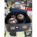 A SET OF VINTAGE BOWLING BALLS IN A CASE