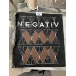 A FOLDER OF PHOTO NEGATIVES