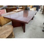 A LARGE BOARDROOM STYLE MAHOGANY TABLE