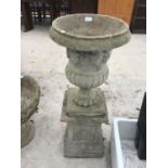 A CONCRETE URN ON A STAND 100CM HIGH
