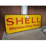 A CAST METAL SHELL SIGN