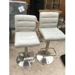 A PAIR OF CRAM LEATHERETTE BAR CHAIRS ON CHROME SUPPORTS