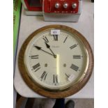 A CHURCHILL CIRCULAR CASED QUARTZ WALL CLOCK