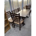 AN OAK REFECTORY DINING TABLE AND FOUR LADDER BACK OAK DINING CHAIRS WITH RUSH SEATS AND TWO