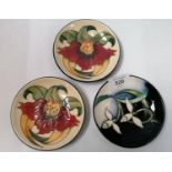 THREE MOORCROFT POTTERY PIN DISHES, A/F