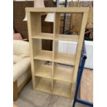 A MODERN BEECH EFFECT SHELVING UNIT