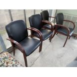 FOUR TEAK DINING CHAIRS WITH BLACK LEATHERETTE SEATS AND BACKS