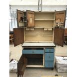 A VINTAGE EASIWORK STREAMLINE DELUXE MODEL KITCHEN CABINET WITH ACCESSORIES TO INCLUDE JARS, EGG