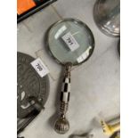 A CHECKER HANDLED MAGNIFYING GLASS