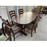 A GOOD QUALITY OAK EXTENDING DINING TABLE WITH TWO CARVERS AND FOUR DINING CHAIRS