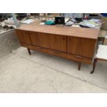 A PORTWOOD FURNITURE LONG LOW RETRO TEAK SIDEBOARD WITH FOUR DOORS AND FOUR DRAWERS