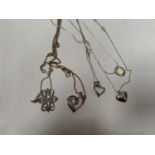A COLLECTION OF FIVE ASSORTED SILVER NECKLACES